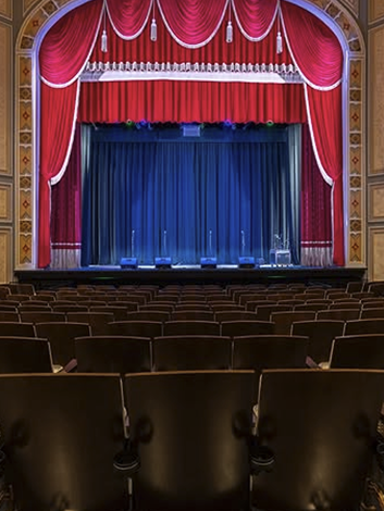 Carolina Theater stage with red velvet curtains